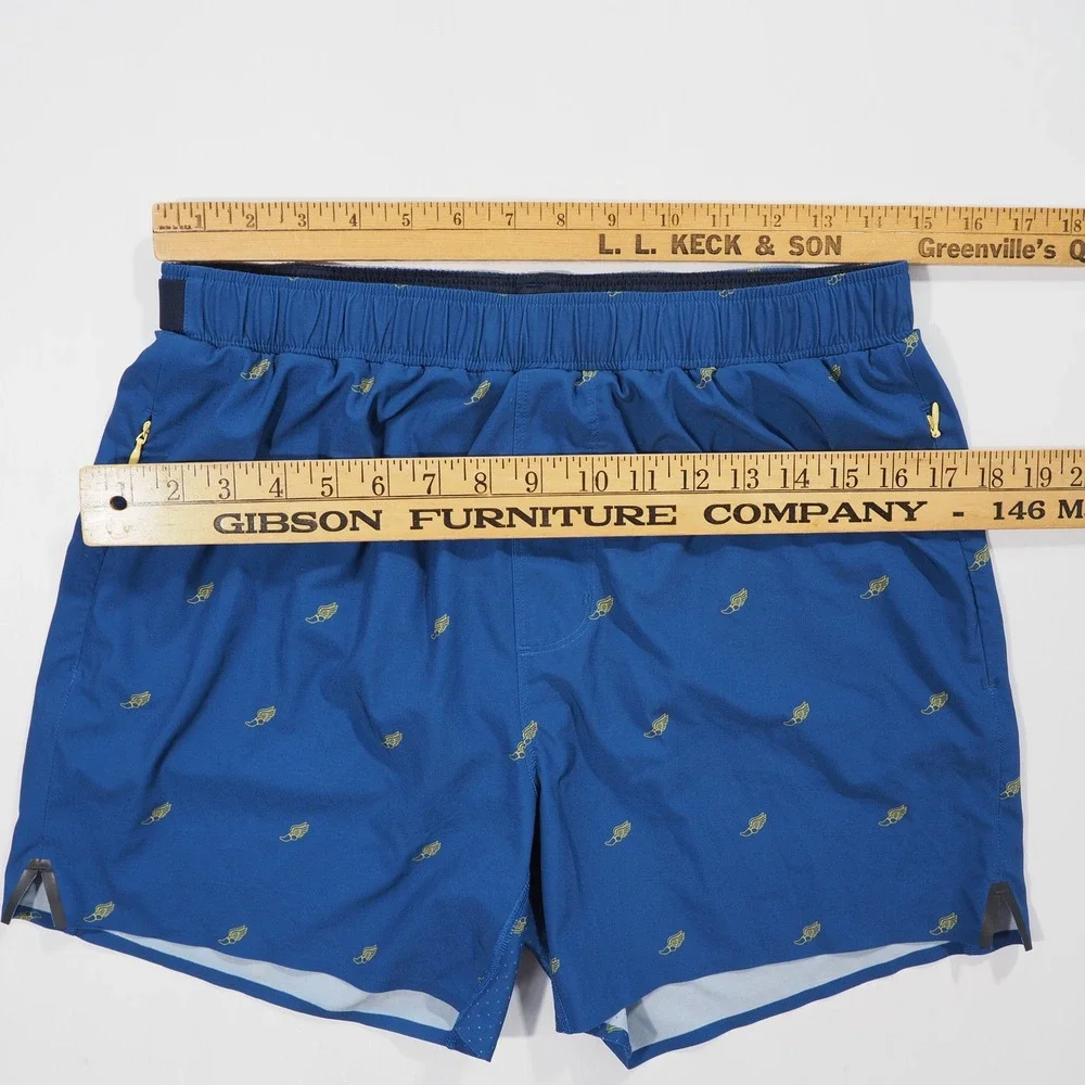 Rhone Swift Academy Shorts Men Medium Blue Winged Foot Print Lined Athletic Loop